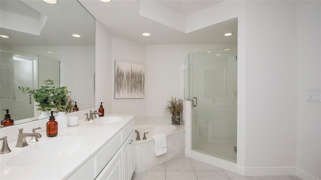 bathroom with tile flooring, separate shower and tub, and dual vanity