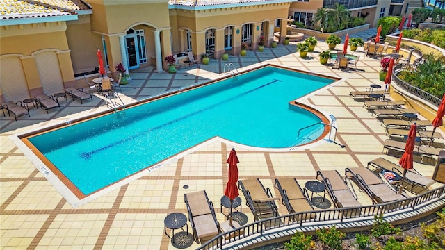 view of swimming pool featuring a patio