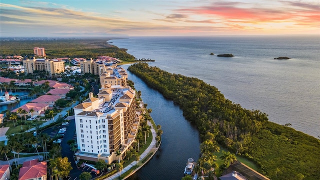 aerial view at dusk with a water view