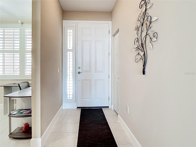 tiled foyer with a healthy amount of sunlight