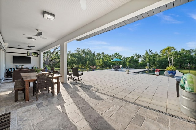 view of patio with an outdoor living space and ceiling fan