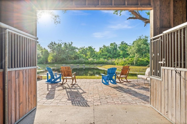 view of stable with a water view