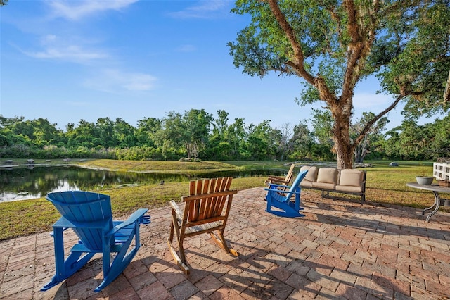 view of patio with a water view