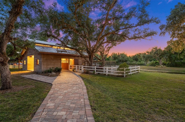 view of front of property with a yard