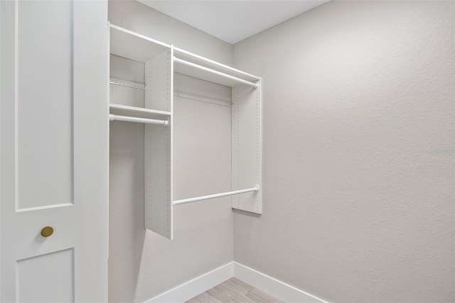 spacious closet featuring hardwood / wood-style floors