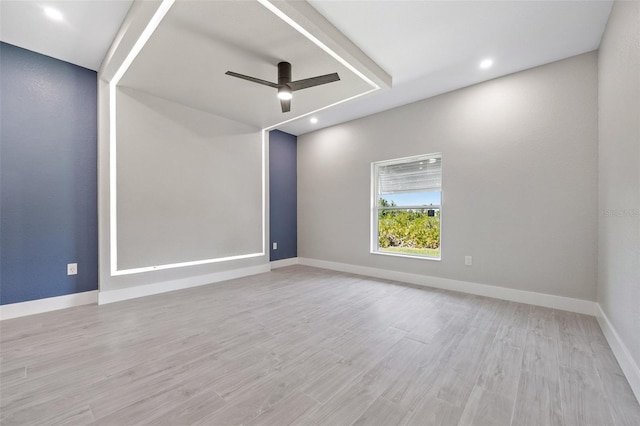 empty room featuring light wood-type flooring and ceiling fan