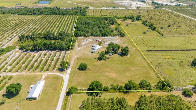 birds eye view of property with a rural view