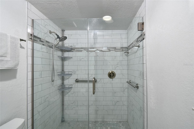 bathroom featuring walk in shower and toilet