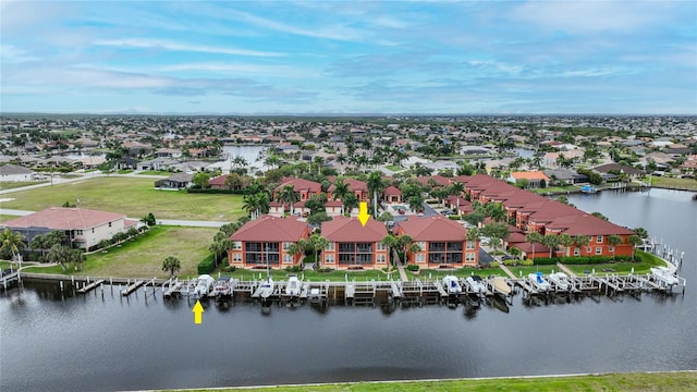 birds eye view of property with a water view