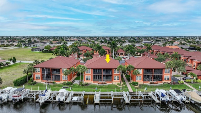 birds eye view of property with a water view