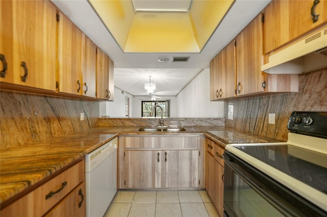 kitchen featuring backsplash, white appliances, ceiling fan, and sink