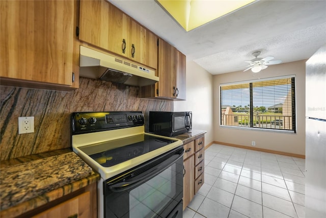 kitchen featuring ceiling fan, light tile flooring, electric range, and a textured ceiling