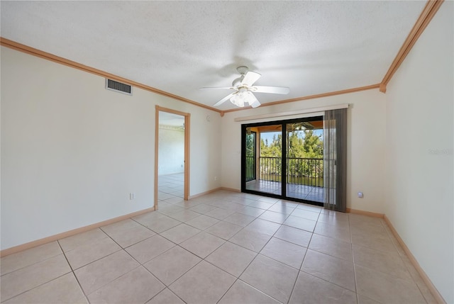 empty room featuring crown molding, ceiling fan, a textured ceiling, and light tile flooring