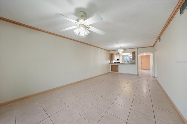 spare room with crown molding, ceiling fan, and light tile floors