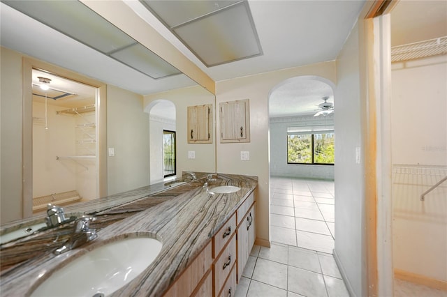 bathroom with ceiling fan, tile floors, and dual bowl vanity