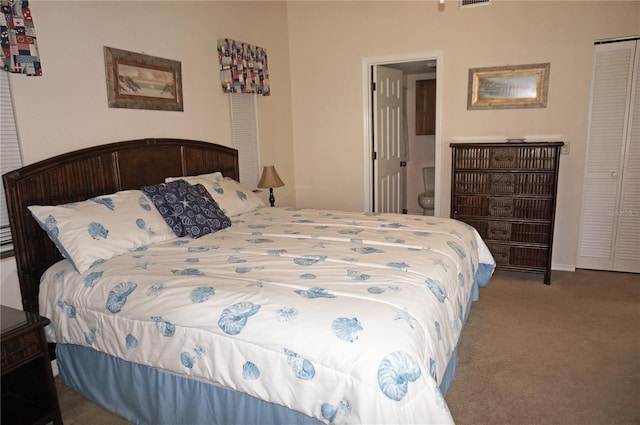 bedroom with light colored carpet and a closet