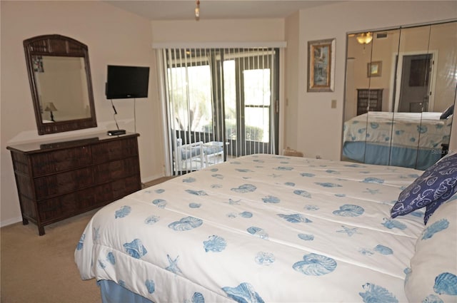 carpeted bedroom featuring access to outside