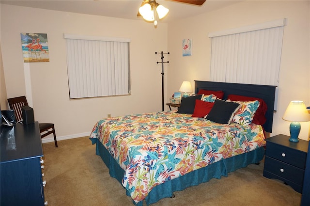 bedroom featuring light colored carpet and ceiling fan