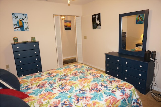 carpeted bedroom with a closet