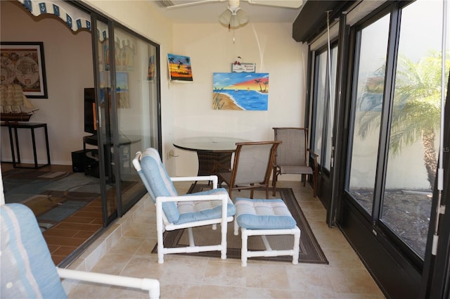 sunroom / solarium with ceiling fan