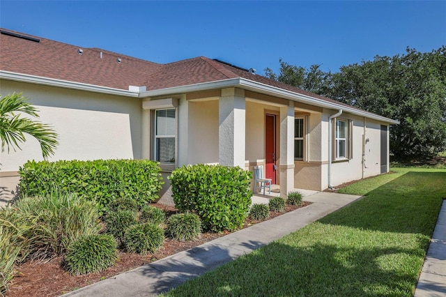 view of property exterior featuring a lawn