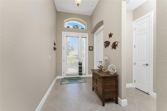 entryway with light tile patterned floors