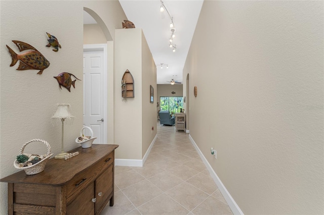 corridor featuring light tile patterned floors