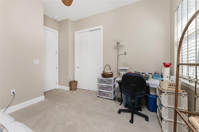 carpeted office space with a healthy amount of sunlight