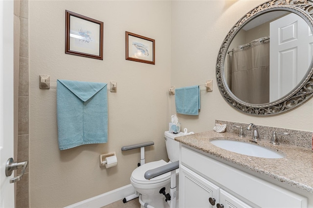 bathroom featuring vanity, toilet, and walk in shower