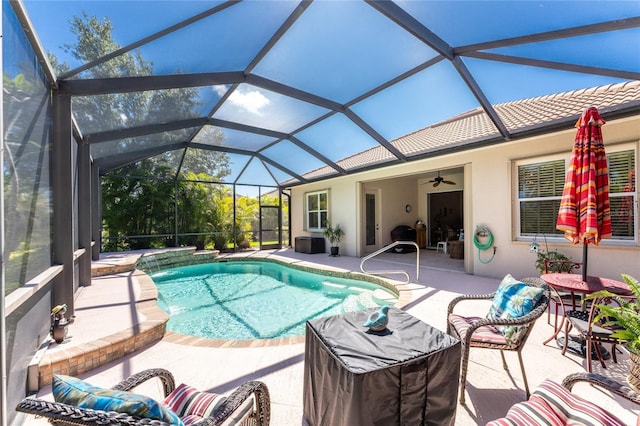 view of pool featuring a lanai, a patio, and ceiling fan