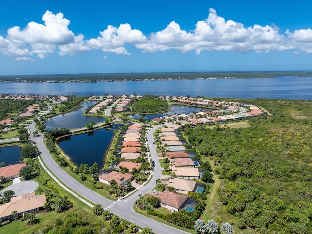 birds eye view of property with a water view