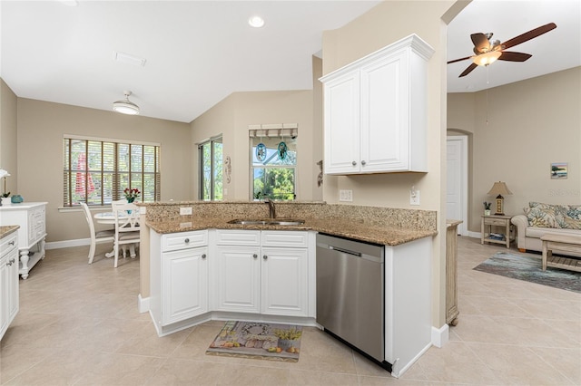 kitchen featuring white cabinets, dishwasher, sink, stone countertops, and kitchen peninsula