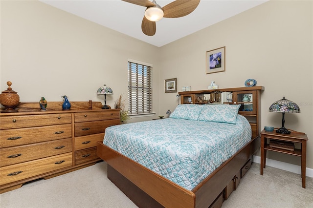 bedroom with ceiling fan and light colored carpet