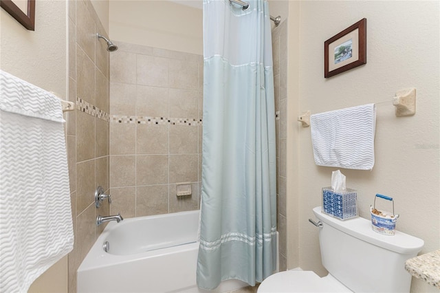 bathroom featuring toilet and shower / bathtub combination with curtain