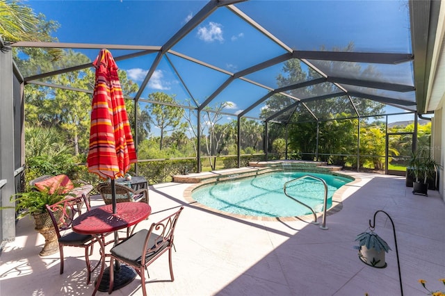 view of pool with a patio and a lanai