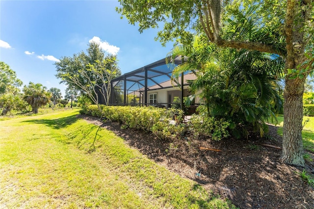 view of yard featuring glass enclosure