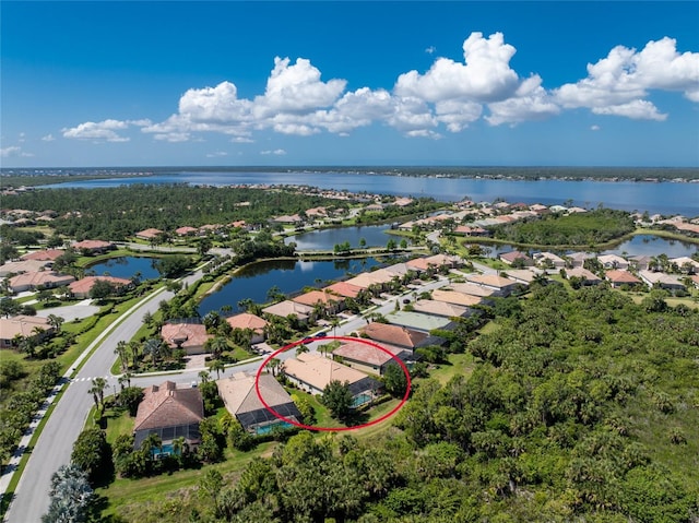 birds eye view of property featuring a water view