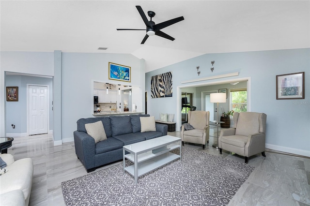 living room with ceiling fan, light wood-type flooring, and vaulted ceiling