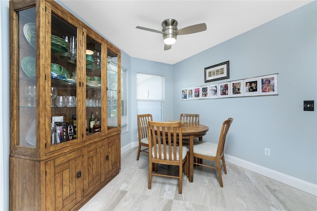 dining space with ceiling fan