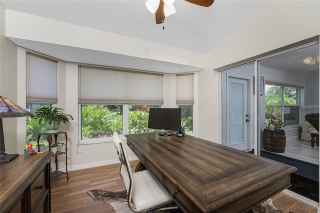 office space featuring ceiling fan, dark hardwood / wood-style flooring, and lofted ceiling