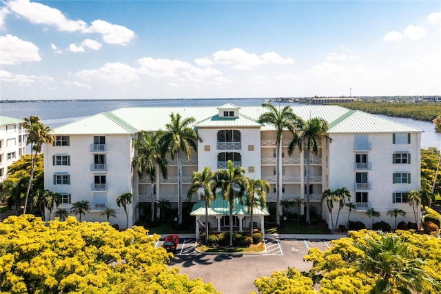 view of building exterior with a water view