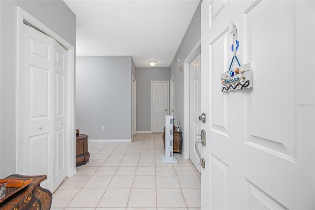 corridor with light tile flooring