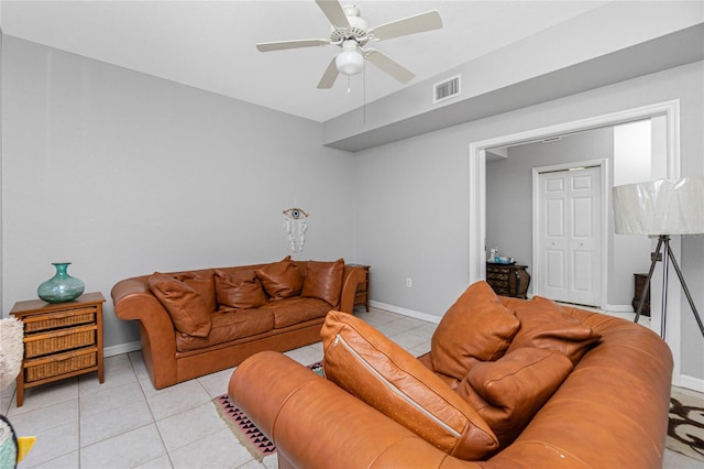 living room featuring ceiling fan and light tile floors