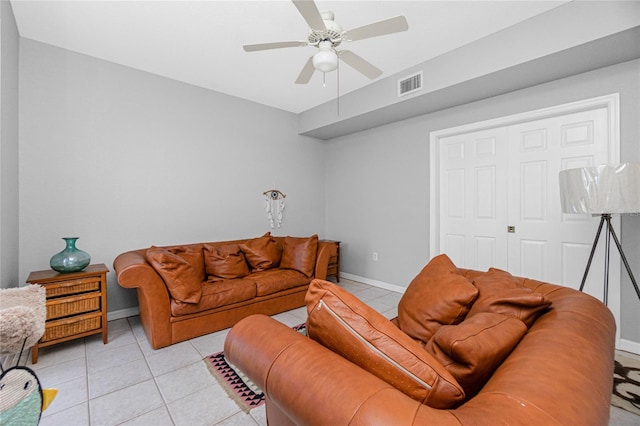 living room featuring ceiling fan and light tile flooring