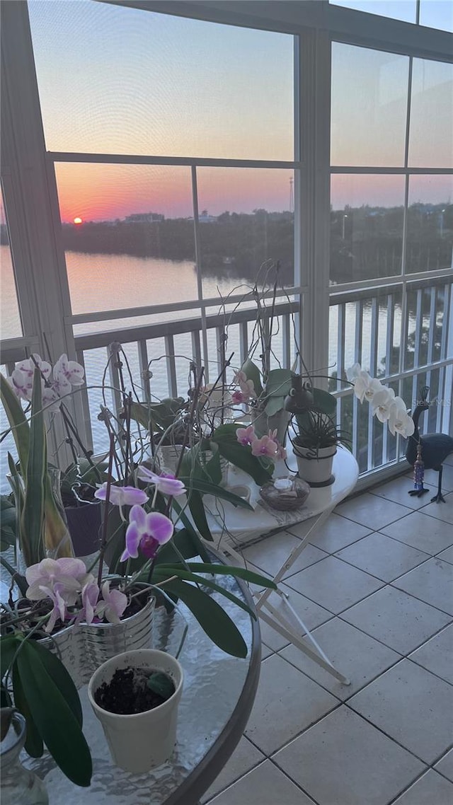 balcony at dusk with a water view