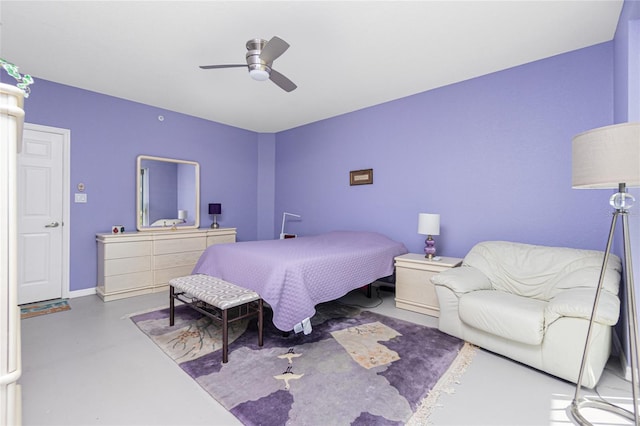 bedroom featuring ceiling fan and concrete flooring