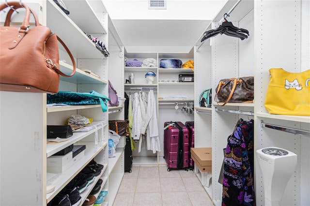 spacious closet featuring light tile floors