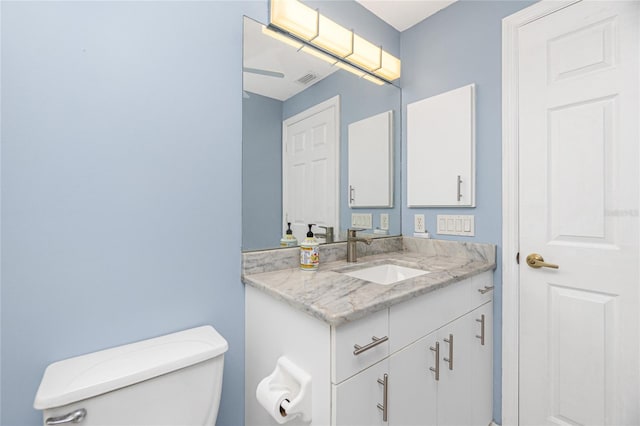 bathroom with toilet and oversized vanity