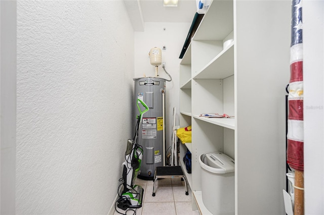 utility room featuring water heater