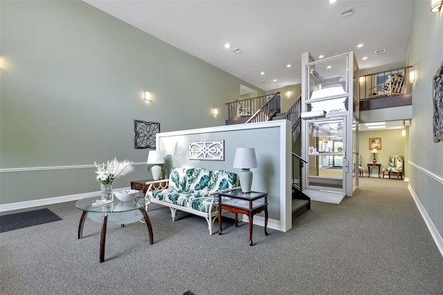 interior space with carpet flooring and a towering ceiling